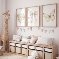 Beige gold wall art set with heart, bow, and butterfly prints. Neutral nursery, modern decor for bedroom, nursery, girls room, teen room
